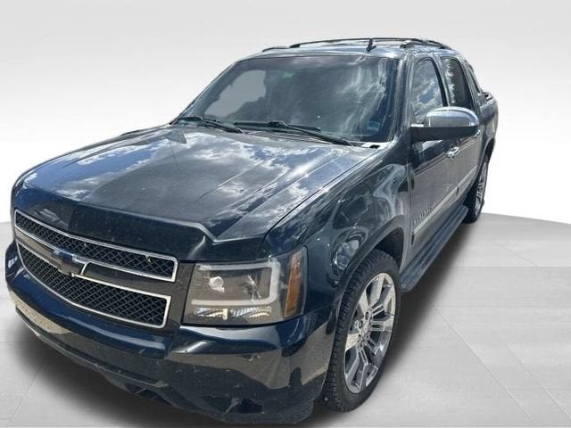 2012 Chevrolet Avalanche LTZ in Black — front three-quarter view