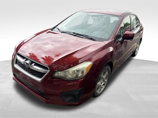 2012 Subaru Impreza 2.0i Premium in Camellia Red Pearl — front three-quarter view